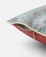 Side view showing powder-blue front, rose reverse and hidden zip