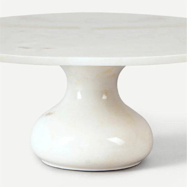Full side profile of the hand-carved Makrana marble cake stand from Rajasthan, India, showing the hourglass pedestal and 11.5-inch circular serving platform with natural stone veining.