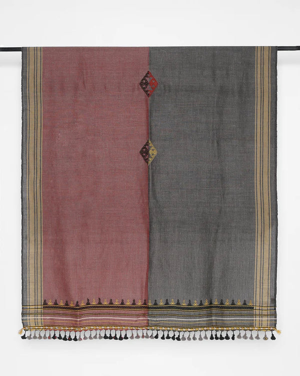 Full view of the dual-tone rose and charcoal merino wool throw