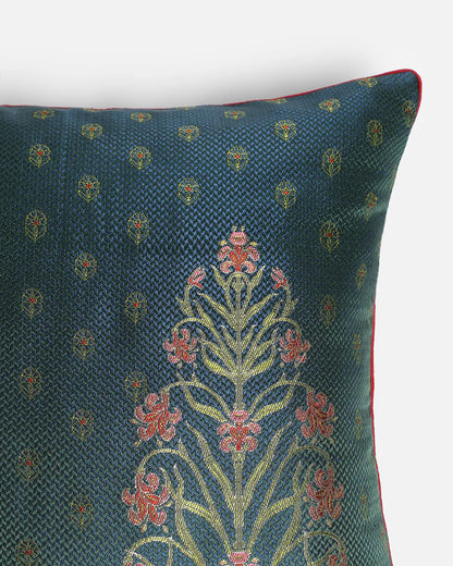 Extreme close-up of the intricate Iris floral pattern handwoven in rose, coral, and gold silk threads using the traditional Banarasi Gyasar technique.