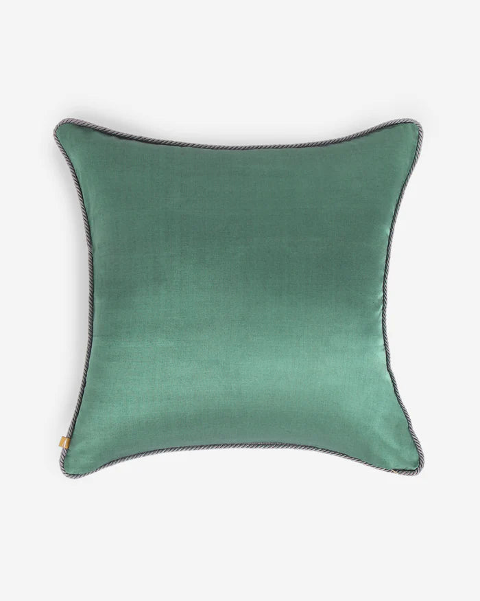 The reverse side of the Gyasar pillow showing a smooth, solid face of deep sage green silk with a tonal corded trim.