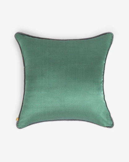The reverse side of the Gyasar pillow showing a smooth, solid face of deep sage green silk with a tonal corded trim.