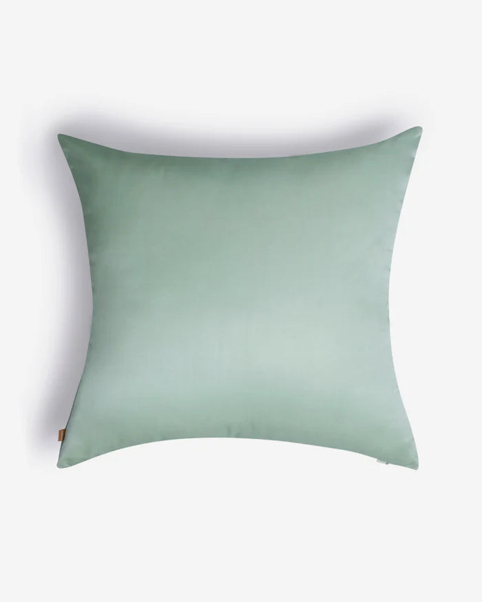 The minimalist companion side of the pillow in smooth, solid seafoam green silk.