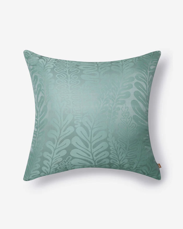 Full studio front view of the Seafoam Fern pillow, showcasing the subtle raised texture of the cascading fronds.