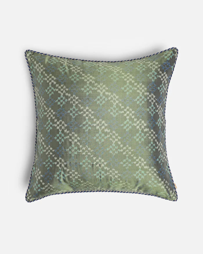 The Silken Sage dual-sided pillow featuring a sage green hand-loomed Pochampally ikat silk front.