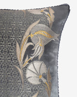 Extreme close-up of the silver geometric lattice silk weave flanked by woven gold-tipped Persian tulip motifs.