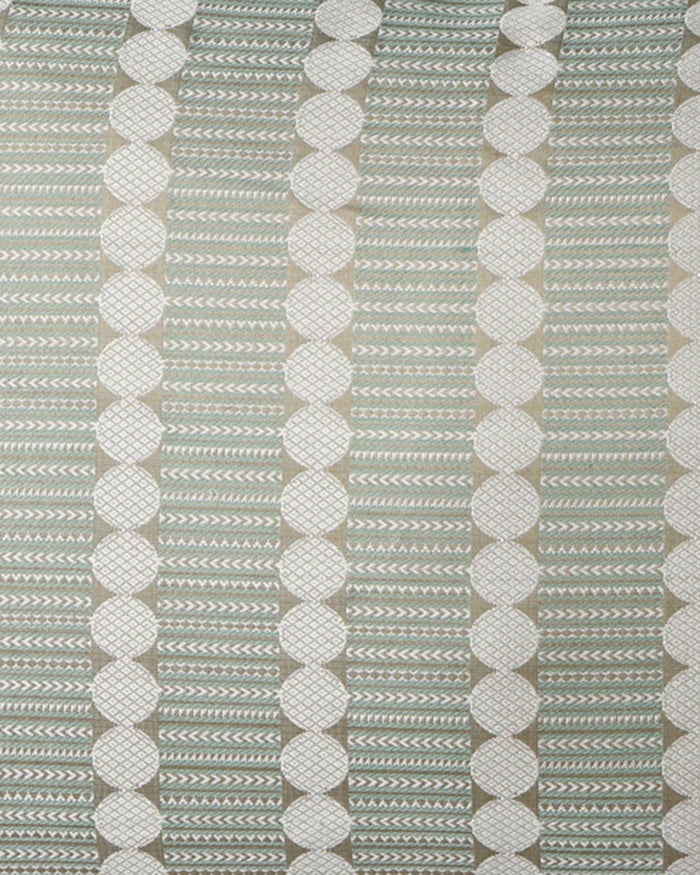 Macro close-up of the Tanchoi weave, showing the raised texture of the ivory circles and intricate sage green chevrons.