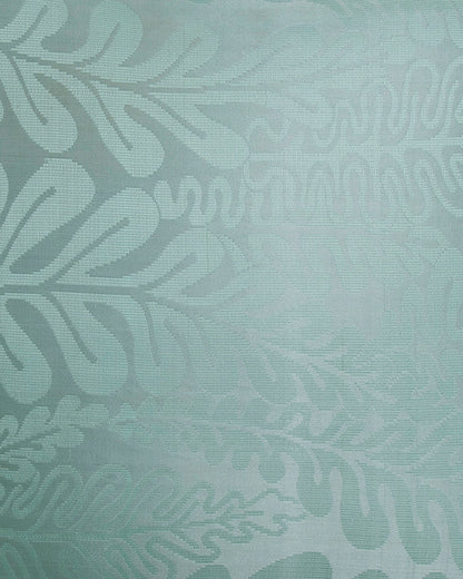 Macro close-up of the luminous seafoam silk, showing the intricate structural weave of the raised fern fronds.