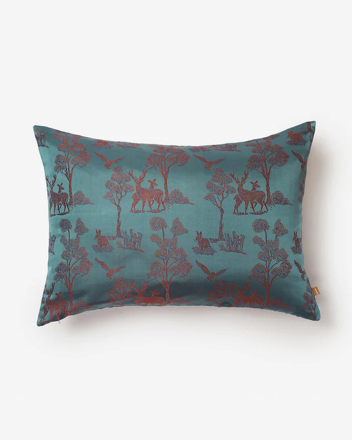 The Forest Tanchoi silk pillow featuring merlot woodland animals on teal silk.