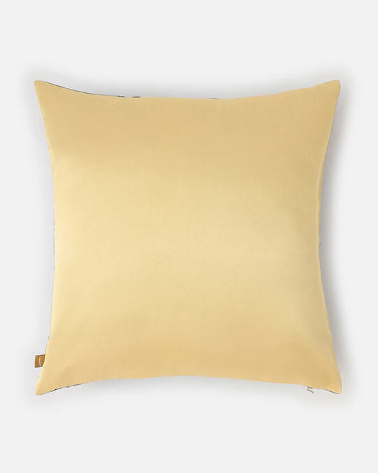 Solid butter yellow silk reverse on a dual-sided double ikat cushion.